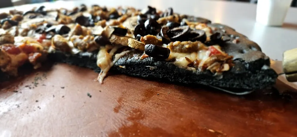 Mushrooms Olives and Sausage Pizza